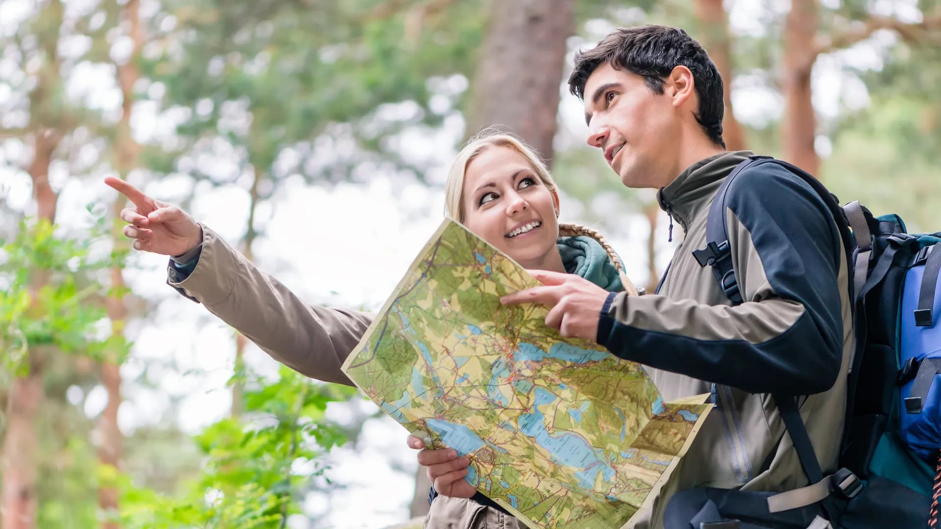 Students exploring with maps during an educational tour