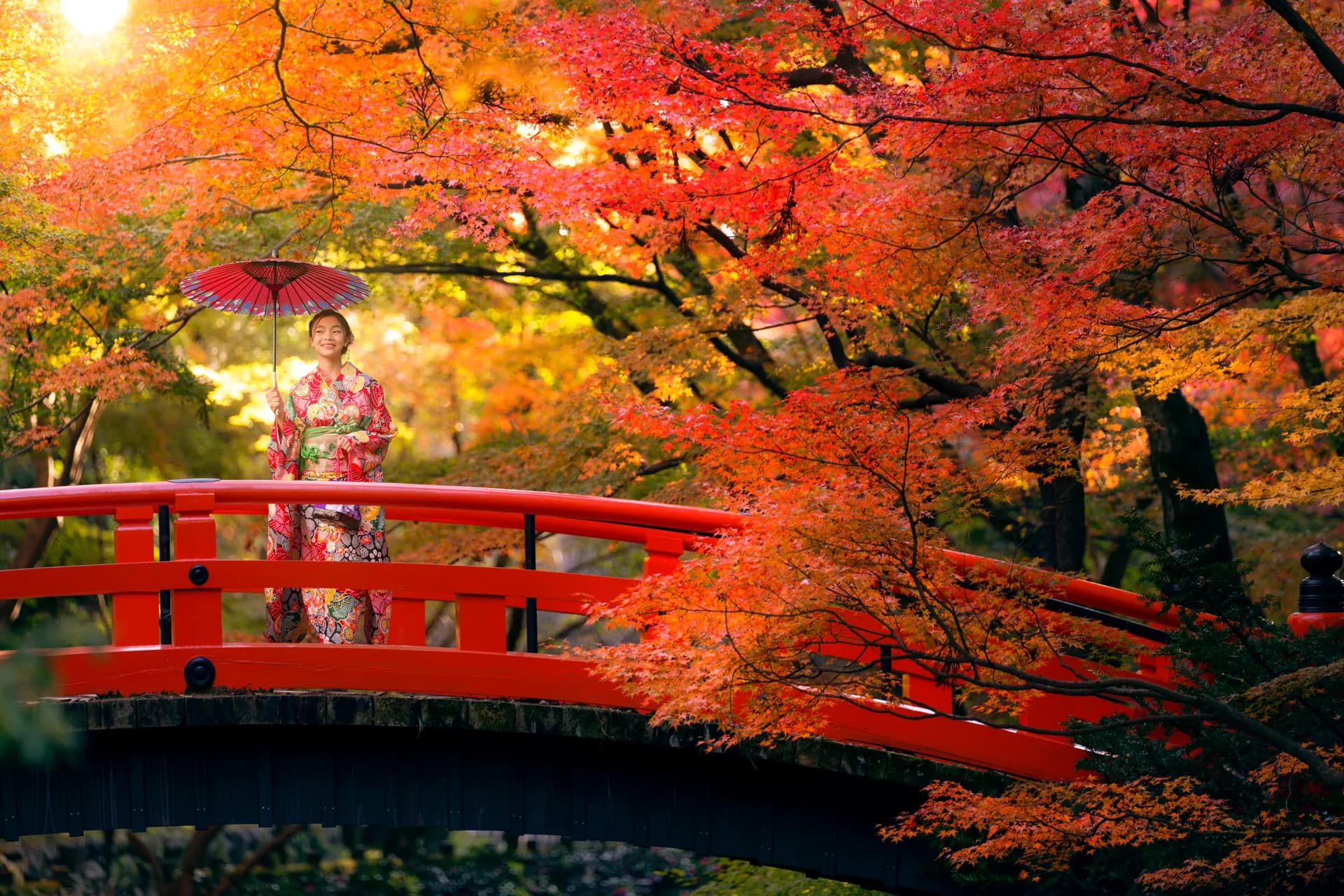 Visitor in traditional kimono at Kinkaku-ji Golden Temple in Kyoto