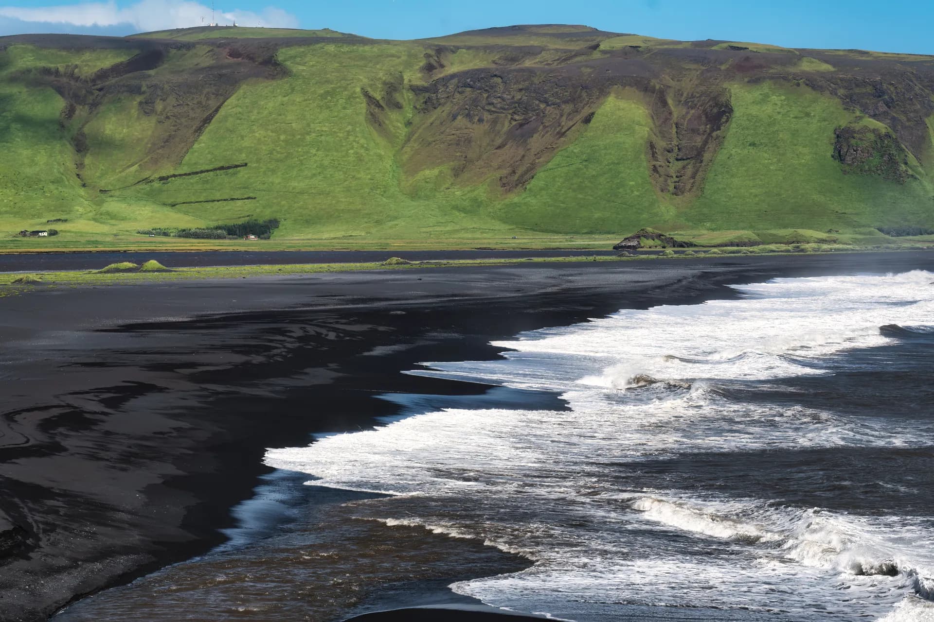 Reynisfjara black sand beach with dramatic sea stacks in South Iceland