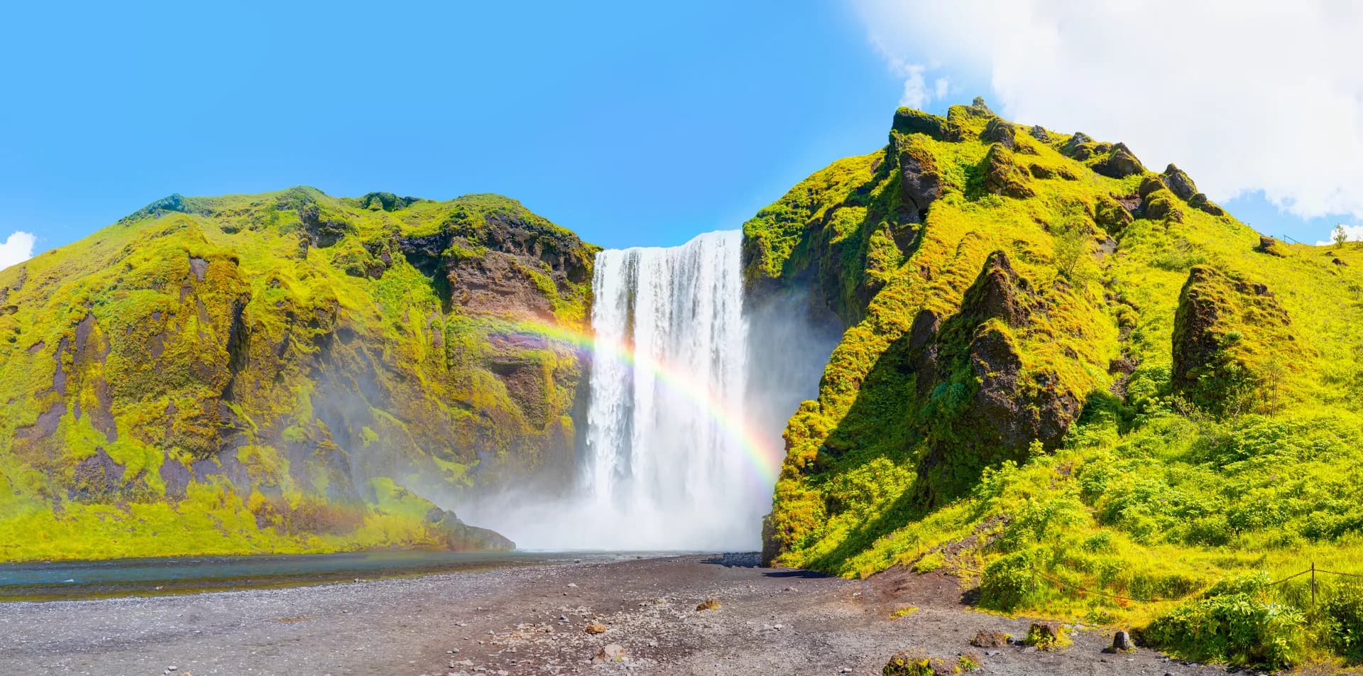 Skógafoss waterfall with rainbow on the south coast of Iceland